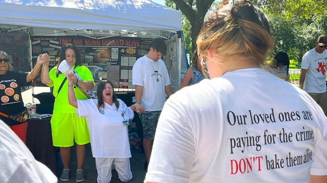 Tona Southards, whose 36-year-old son died in a Texas prison during the June 2023 heat wave, falls to her knees as she leads a prayer circle outside the Texas Capitol. Southards and other prison rights advocates called for Gov. Greg Abbott to call a special session to install air conditioning in Texas prisons.