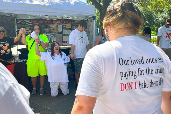 Tona Southards, whose 36-year-old son died in a Texas prison during the June 2023 heat wave, falls to her knees as she leads a prayer circle outside the Texas Capitol. Southards and other prison rights advocates called for Gov. Greg Abbott to call a special session to install air conditioning in Texas prisons. - Texas Tribune / Jolie McCullough