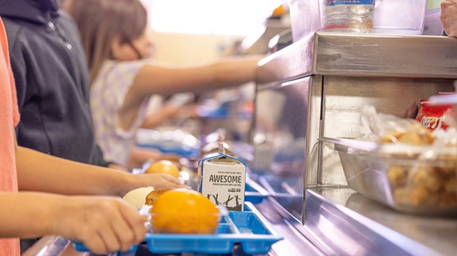 Students line up for school lunches at a North East Independent School District campus.