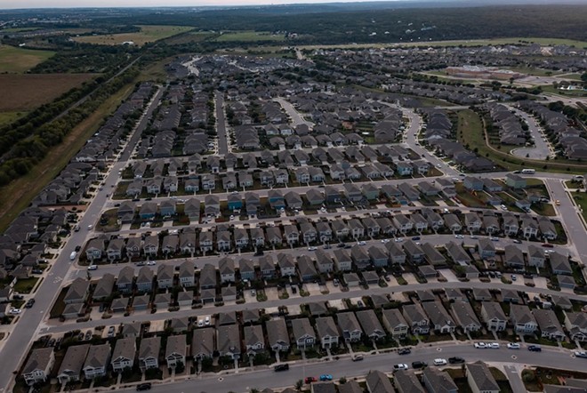 An aerial image of a suburban neighborhood in San Marcos in October 2021. - Texas Tribune / Jordan Vonderhaar