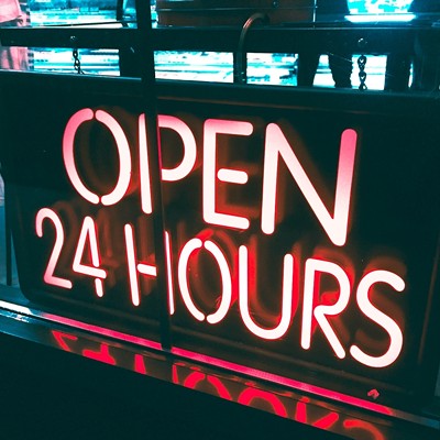 A neon "open 24 hours" sign.