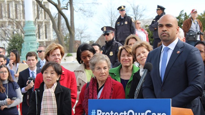 Colin Allred speaks at a press conference in support of the Affordable Care Act.