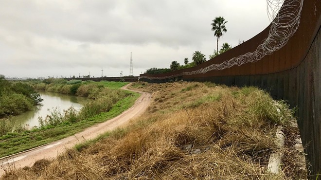 This stretch of South Texas border wall was constructed during the George W. Bush administration, but the coils of barbed wire went up during Trump’s.