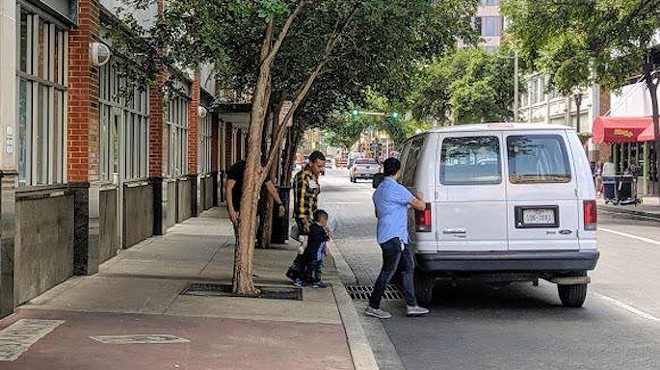 Asylum seekers leave the city's Migrant Assistance Center.