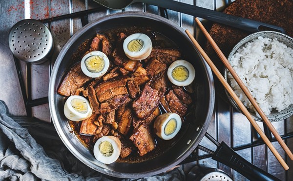 Pork adobo with eggs and rice is a popular dish in the Philippines.