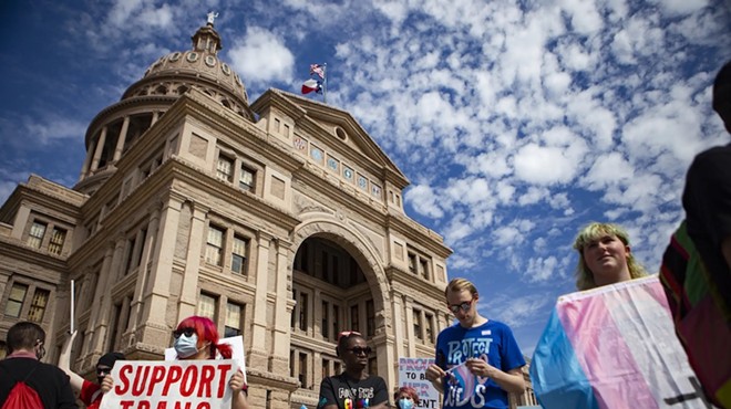 People gather in front of the Texas Capitol during a protest against bills limiting transgender kids' access to puberty blockers and hormone treatments in March.