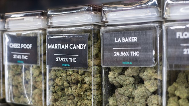 Cannabis varieties on display in a dispensary.