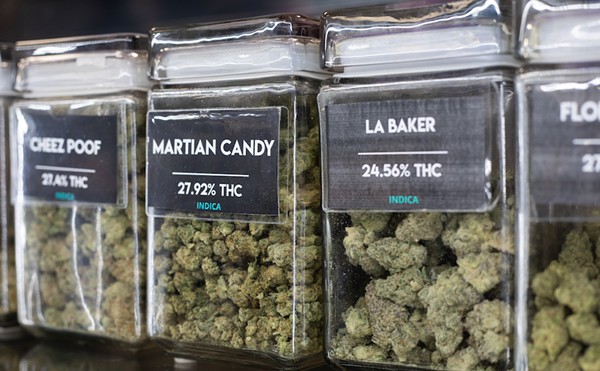 Cannabis varieties on display in a dispensary.